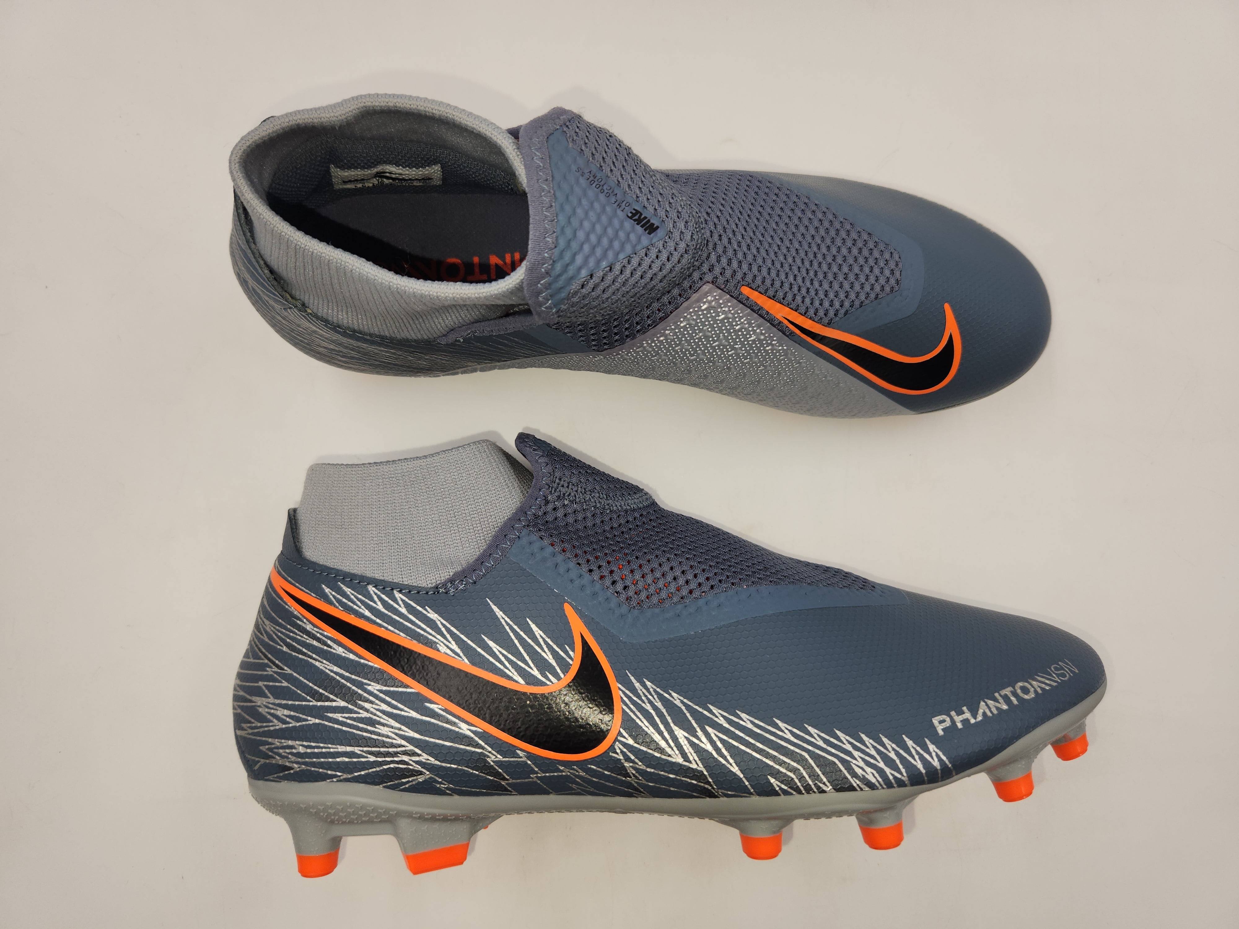 Nike grey and orange cleats online