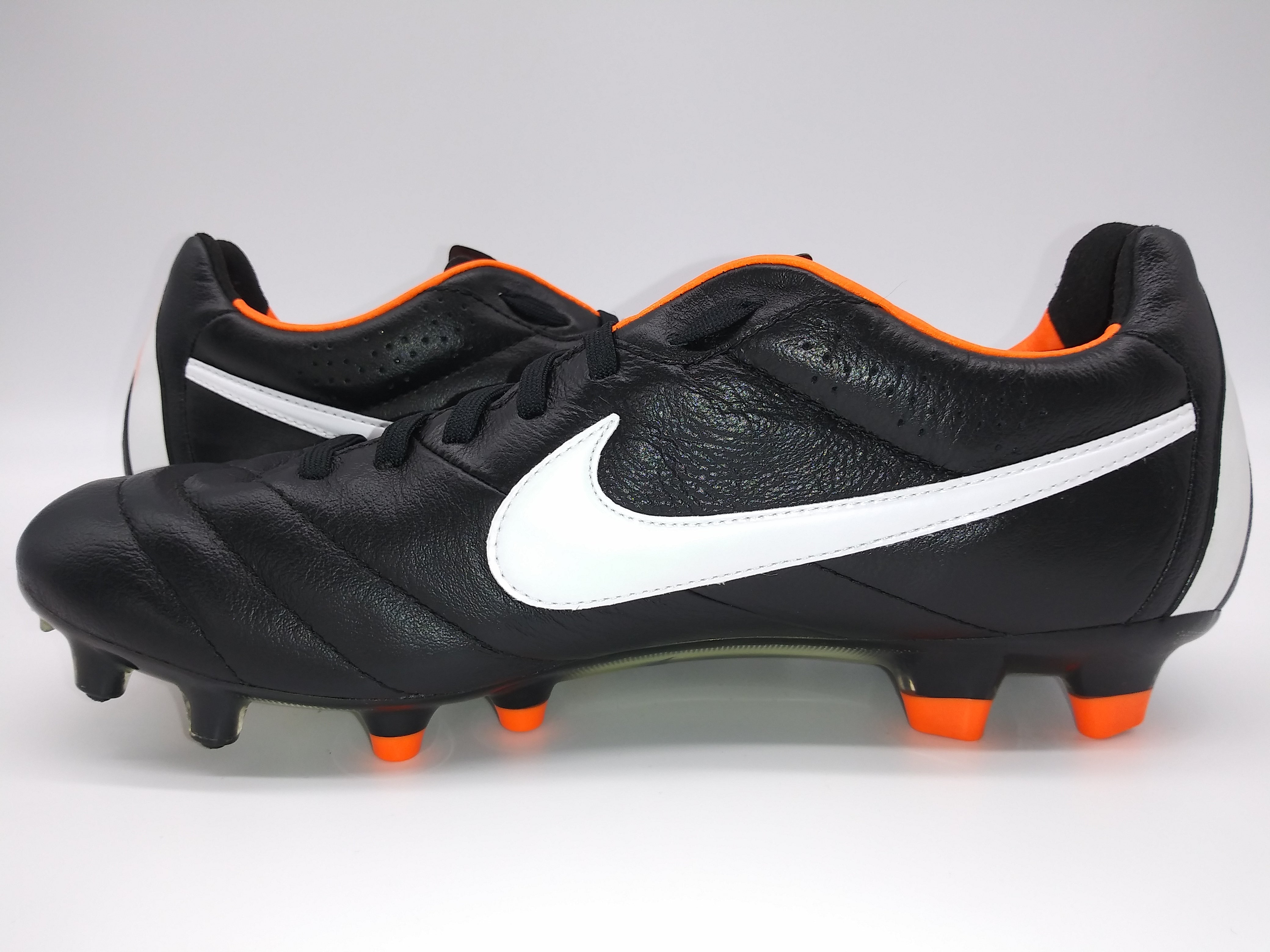 Black and orange nike tiempos on sale