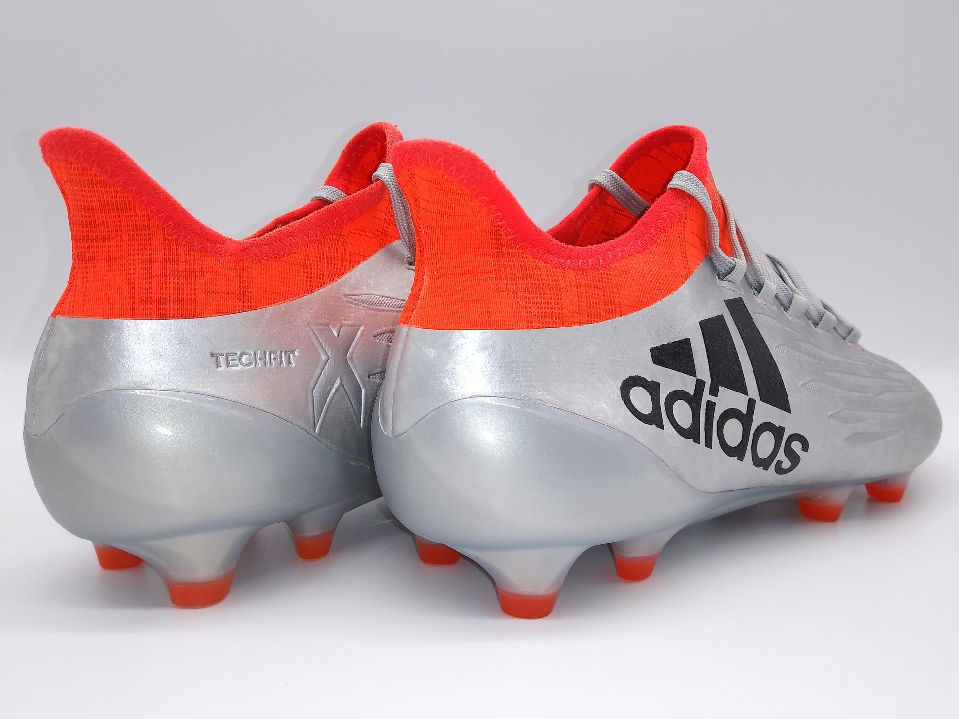 X FG Cleats Silver and Orange Soccer Cleats – Villegas